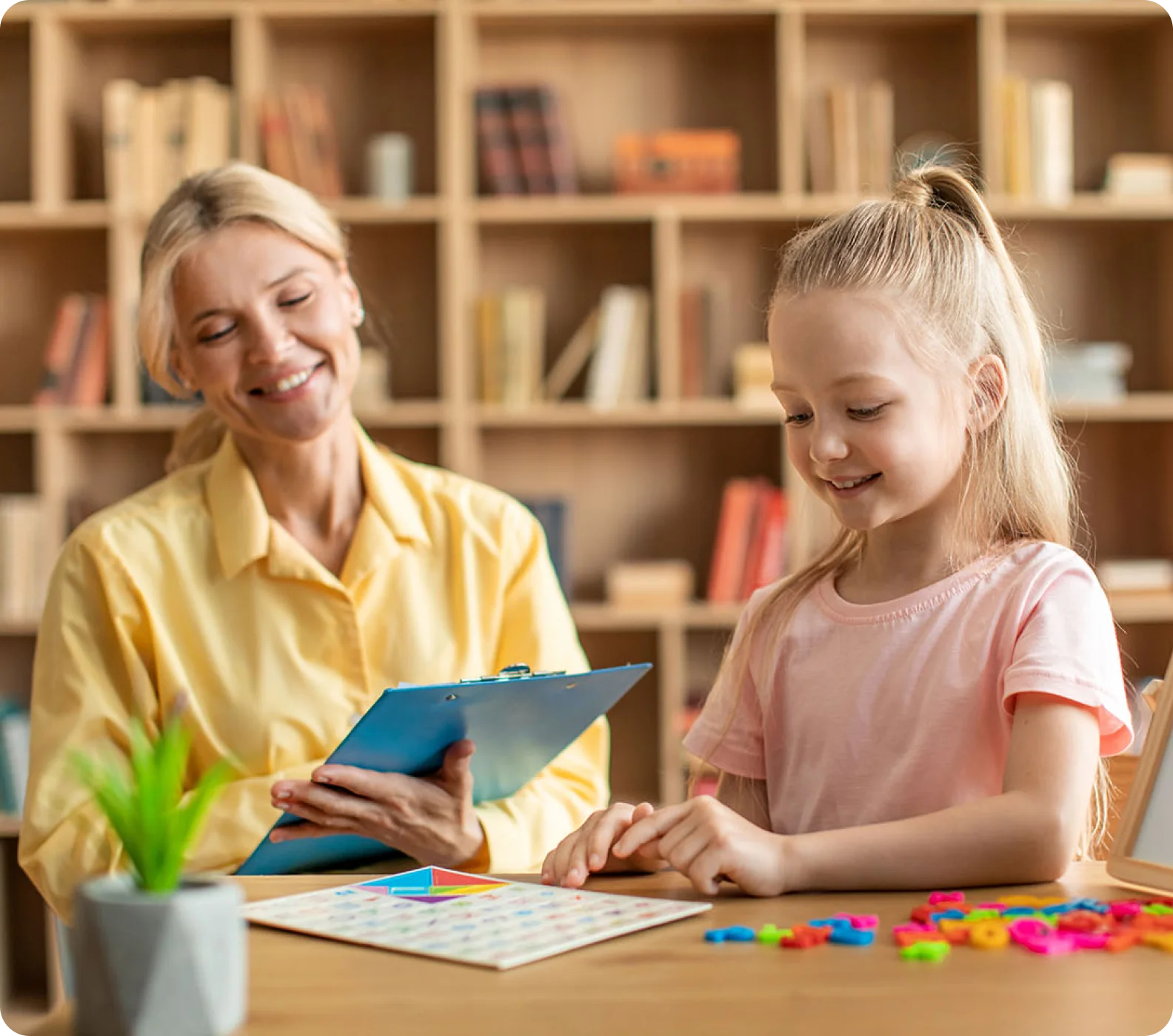 A psychologist works with a child during an evaluation. This image is meant to represent the benefits of working with Lisa Hayden.