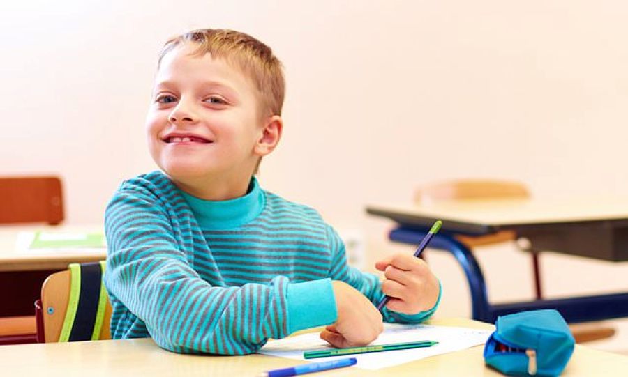 An autistic boy smiling with confidence after support with North Shore Psychological